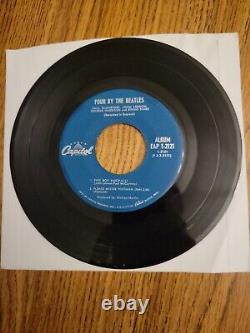 Four By The Beatles' 1964 extended play 7 record withexcellent conditioned cover